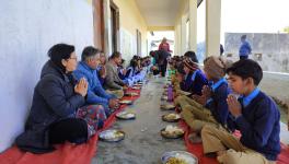 officers of Edu dept eating MDM with students